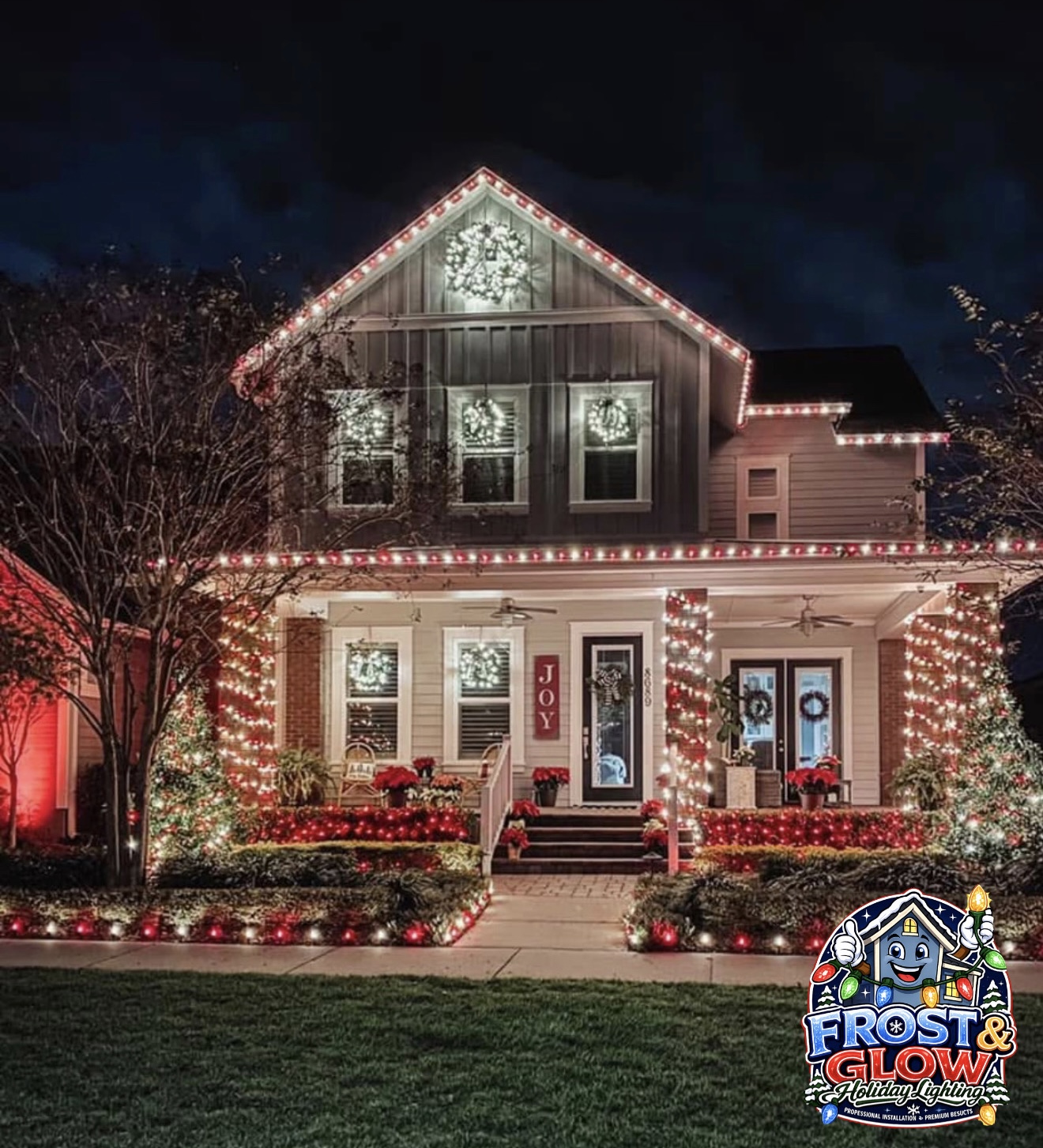 Roofline, porch columns, netted bushes and path lights all tied together on a two-story craftsman.
