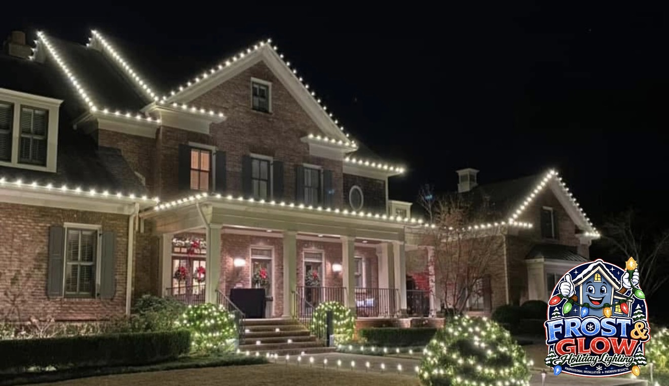 Every gable, dormer and wing outlined in warm white on a sprawling brick estate.
